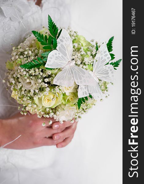 Beautiful bridal bouquet decorated with butterflies