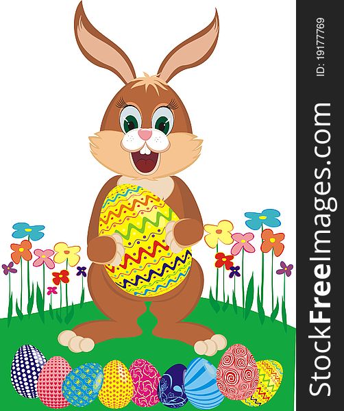 Easter bunny with colorful eggs on a flower glade