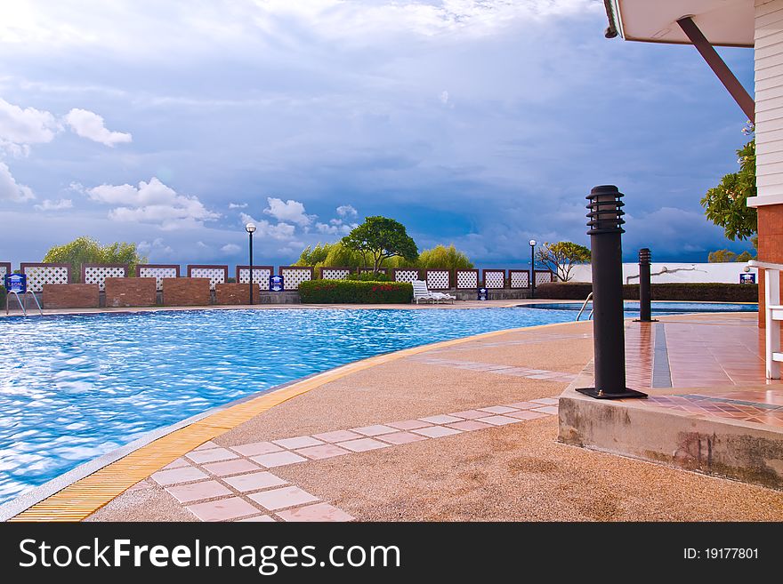 Swimming pool in curve style with blue sky. Swimming pool in curve style with blue sky