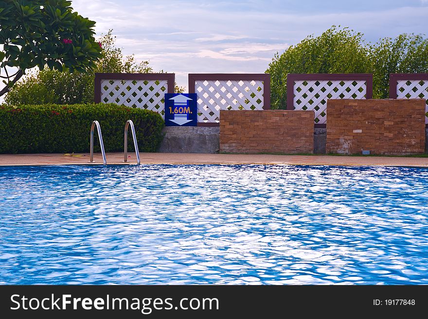 Swimming pool and stairs case with sky in background