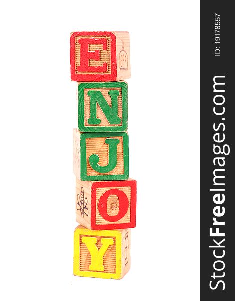 Word Enjoy written with wooden blocks. Word Enjoy written with wooden blocks