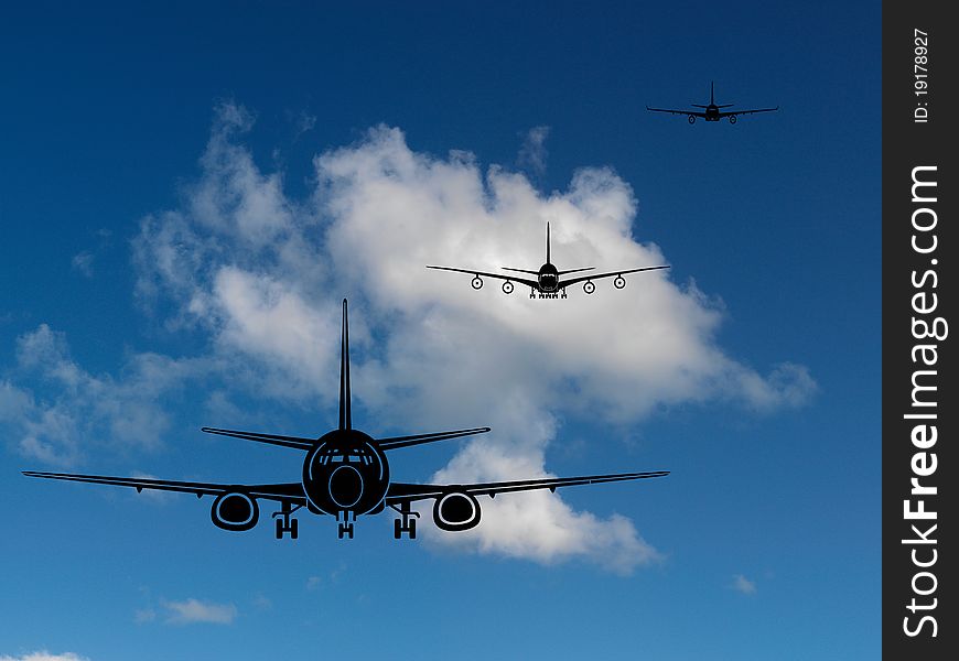 Aircraft silhouetted in a blue sky