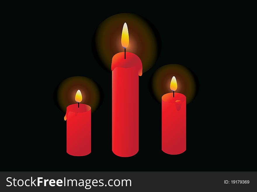 Red candles burning in a dark, black background.