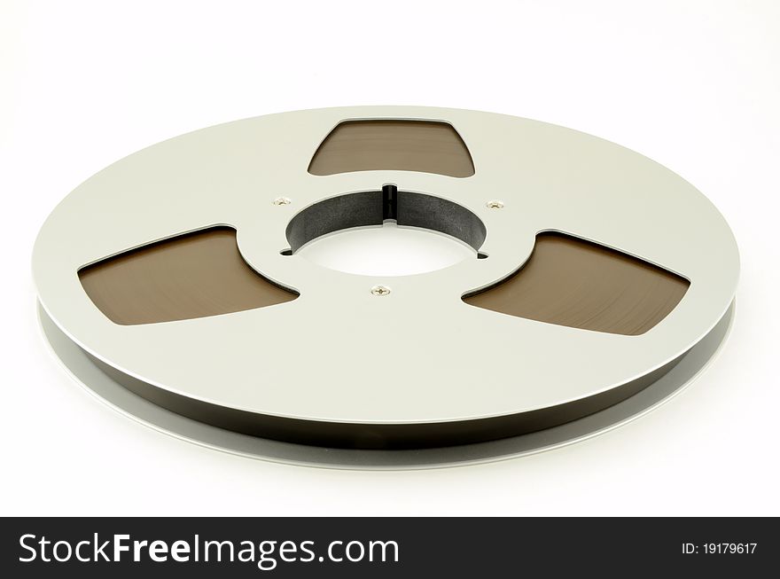 Reel of 1/2 open reel tape on white background