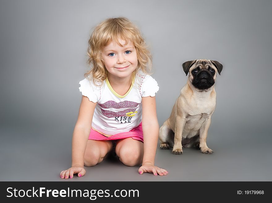 Little Girl Playing With Dog