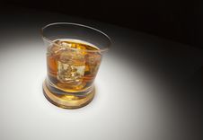 Glass Of Whiskey And Ice Under Spot Light Stock Photography Glass Of Whiskey And Ice Under Spot Light Stock Photography