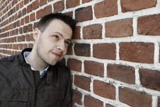 Young Man In Fron Of The Brick Wall Stock Photo Young Man In Fron Of The Brick Wall Stock Photo