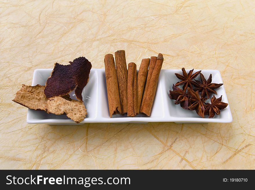 Top view of dried tangerine peel, cinnamon sticks and star anise - herbs and spices. Top view of dried tangerine peel, cinnamon sticks and star anise - herbs and spices.