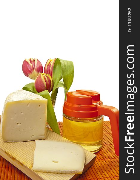 Portions of cheese and
honey on white background. Portions of cheese and
honey on white background