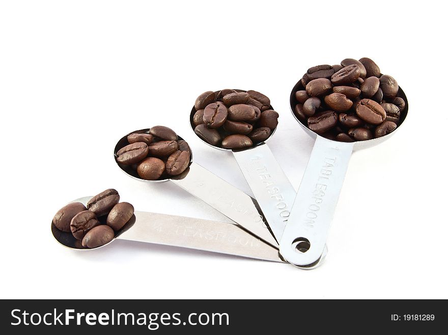 Coffee measure spoon on white background