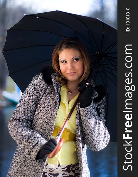 Portrait of beautiful girl with black umbrella. Portrait of beautiful girl with black umbrella