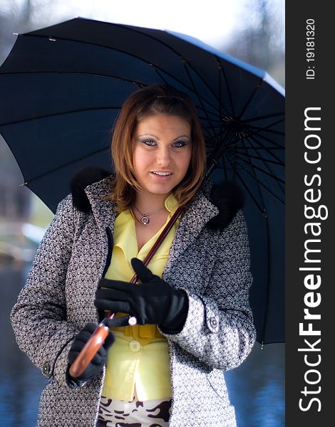 Portrait of beautiful girl with black umbrella. Portrait of beautiful girl with black umbrella