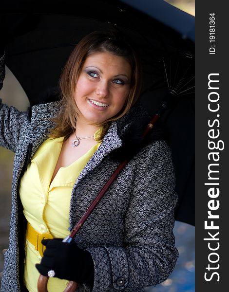 Portrait of beautiful girl with black umbrella. Portrait of beautiful girl with black umbrella