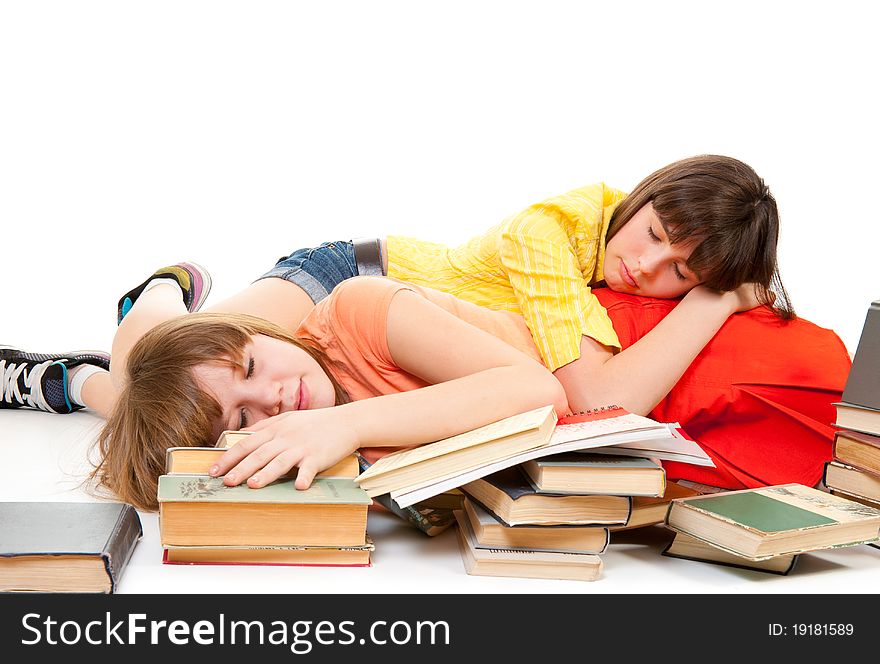 Two schoolgirls were tired of reading books and fell asleep