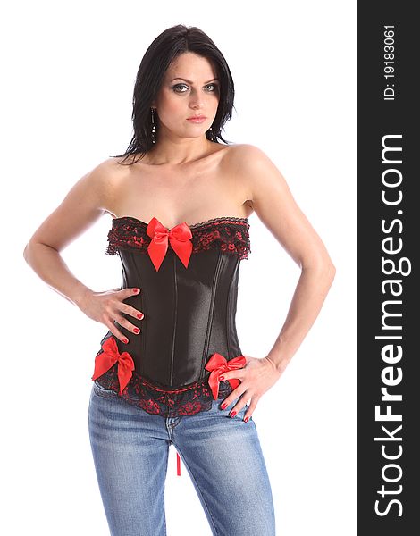 Beautiful young female fashion model posing wearing a black and red corset with lace trimming, and blue denim jeans. Beautiful young female fashion model posing wearing a black and red corset with lace trimming, and blue denim jeans.