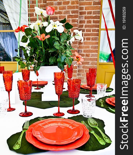 A table setup with Italian flag colours: gree, white and red. A table setup with Italian flag colours: gree, white and red