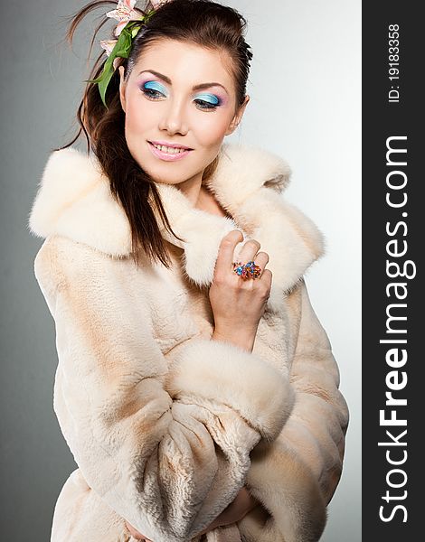 Elegant fashionable woman in a fur coat