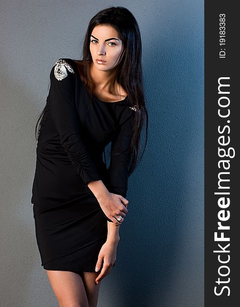 Beautiful fashionable woman in black dress