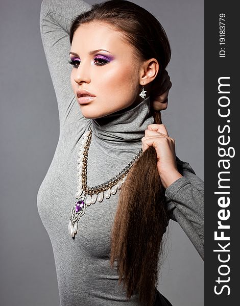 Elegant fashionable woman with violet visage