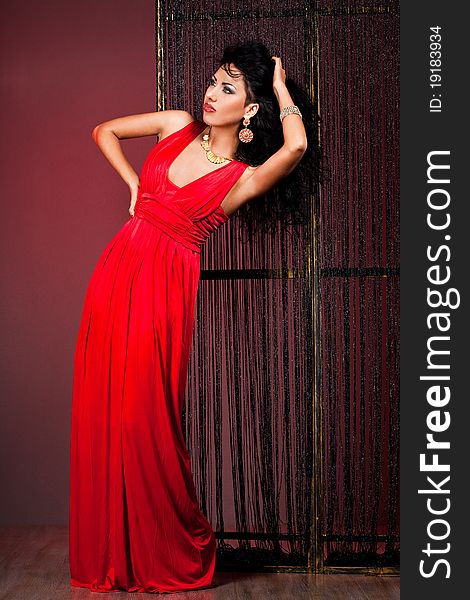 Elegant fashionable woman in red dress