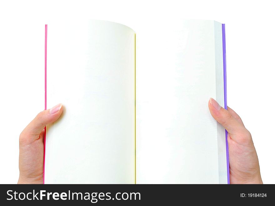 The hand is opening the book that on the white background. The hand is opening the book that on the white background