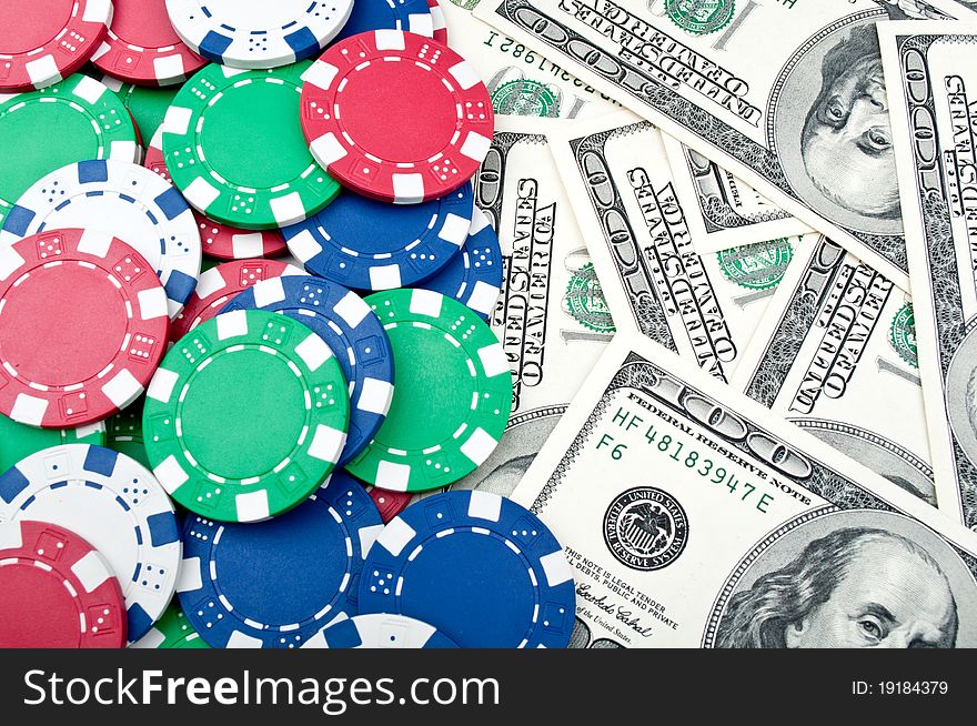 Poker chips and dolars on a background