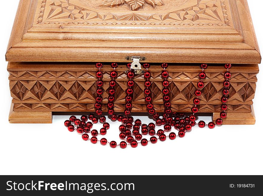 A beautiful wooden box and the beads isolated on white background. A beautiful wooden box and the beads isolated on white background