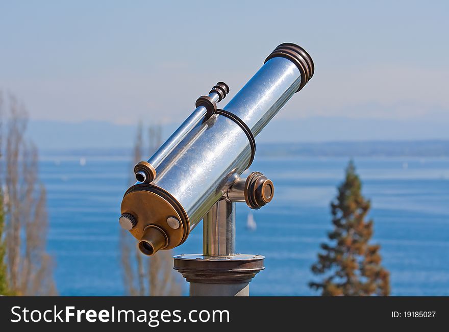 Vintage observation telescope over the sea