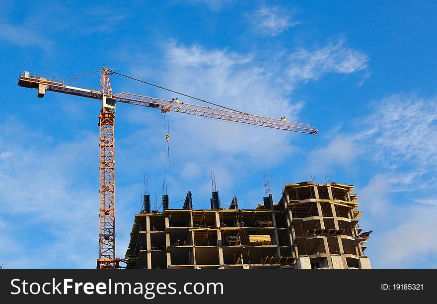 Construction of high-rise building with tower crane. Construction of high-rise building with tower crane