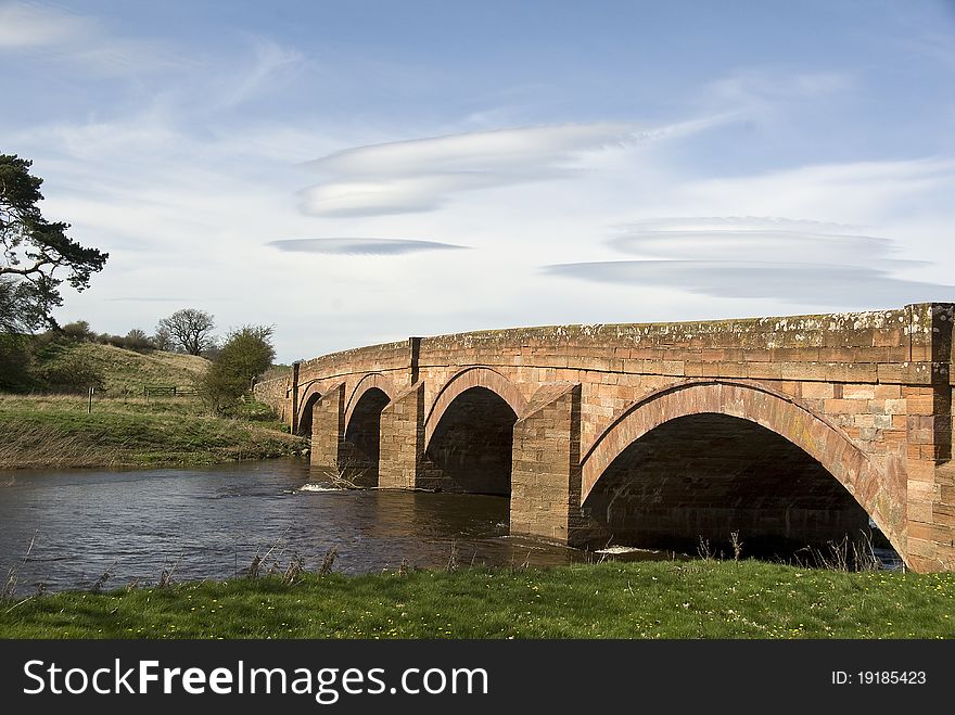 Red sandstone arched bridge across the river Eden,Cumbria,England,historic design. Red sandstone arched bridge across the river Eden,Cumbria,England,historic design.