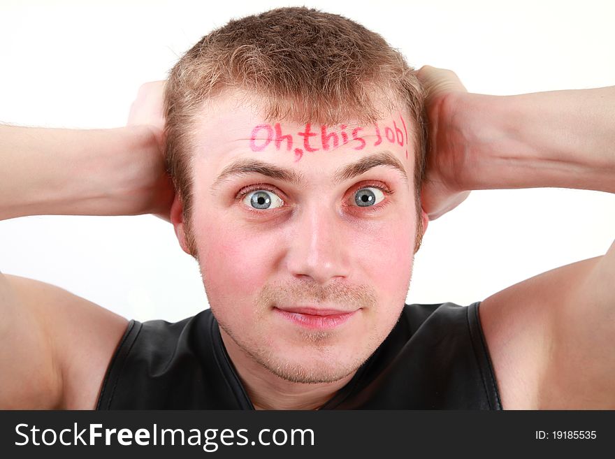 Portrait of a young man with a sign Oh, this job! written on his forehead. Portrait of a young man with a sign Oh, this job! written on his forehead.