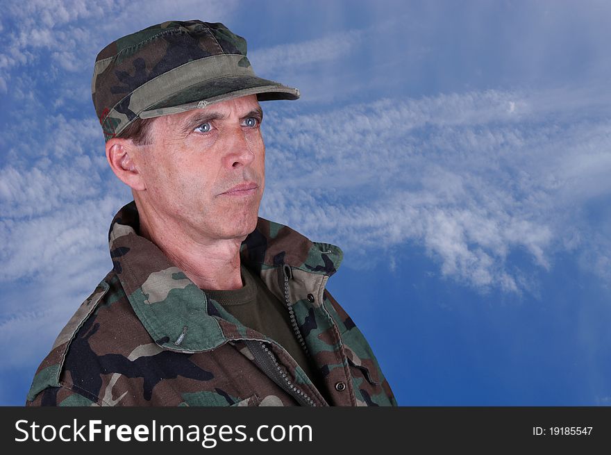 Middle aged army veteran looking up into the distance. Middle aged army veteran looking up into the distance.