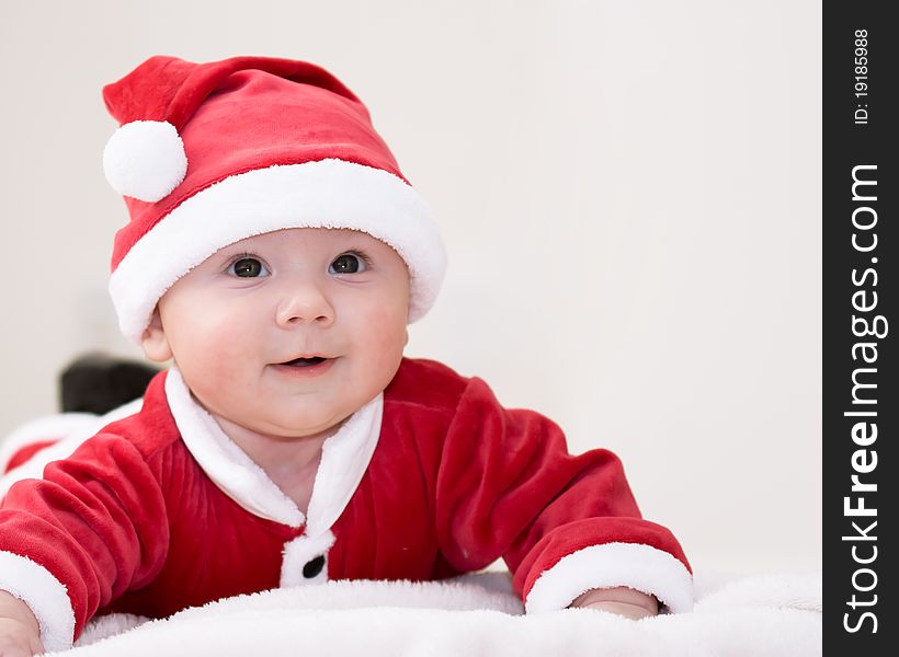 Baby boy wearing santa's costume. Baby boy wearing santa's costume