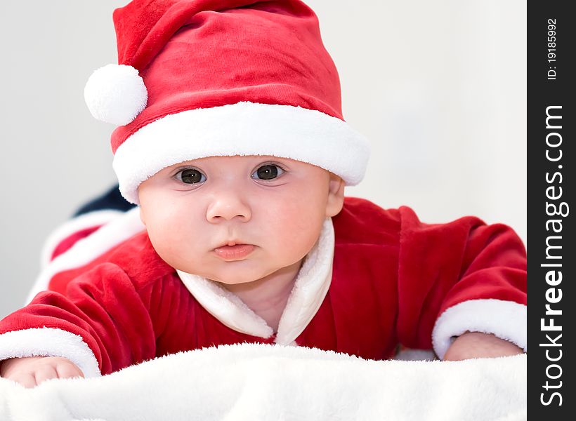 Cute baby boy wearing santa's costume. Cute baby boy wearing santa's costume