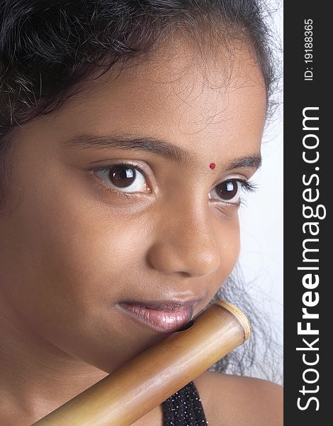 Indian Teenage Girl With Flute