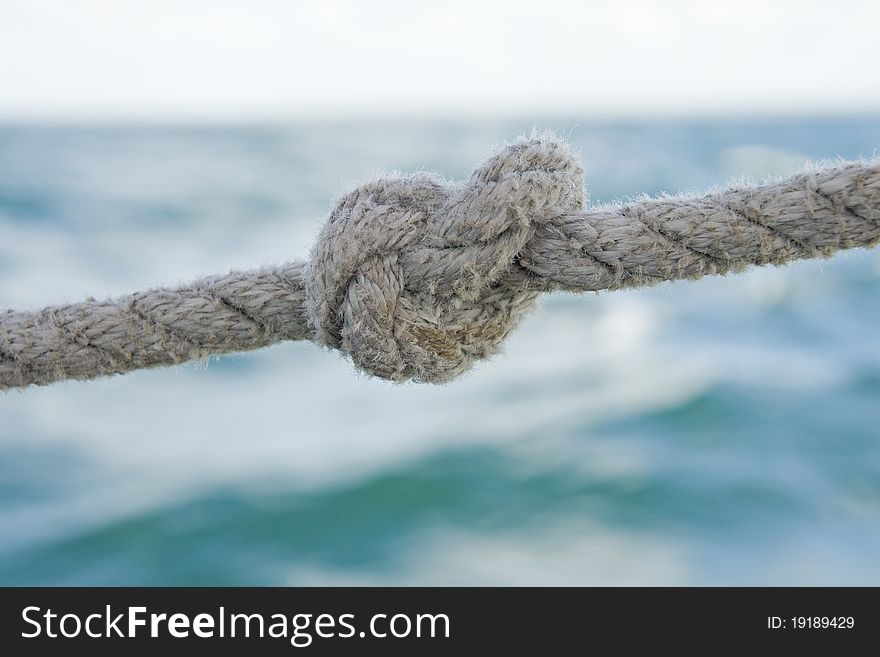 Knot on a rope against sea water