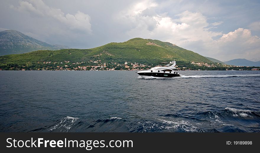 Panoramic view with speedboat in summer mediterranean landscape, Kotor Bay (Montenegro). Panoramic view with speedboat in summer mediterranean landscape, Kotor Bay (Montenegro)