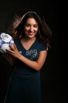 Girl With A Football On Black Royalty Free Stock Images