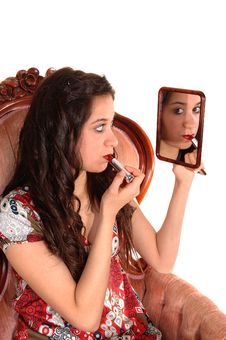 Girl Putting Lipstick On. Royalty Free Stock Image Girl Putting Lipstick On. Royalty Free Stock Image