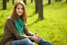 Beautiful Girl Sitting At Green Grass At Park. Royalty Free Stock Image Beautiful Girl Sitting At Green Grass At Park. Royalty Free Stock Image