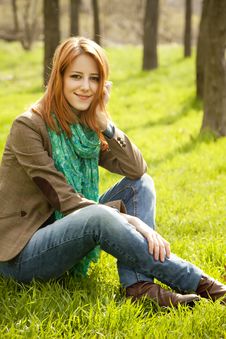 Beautiful Girl Sitting At Green Grass At Park. Royalty Free Stock Image Beautiful Girl Sitting At Green Grass At Park. Royalty Free Stock Image