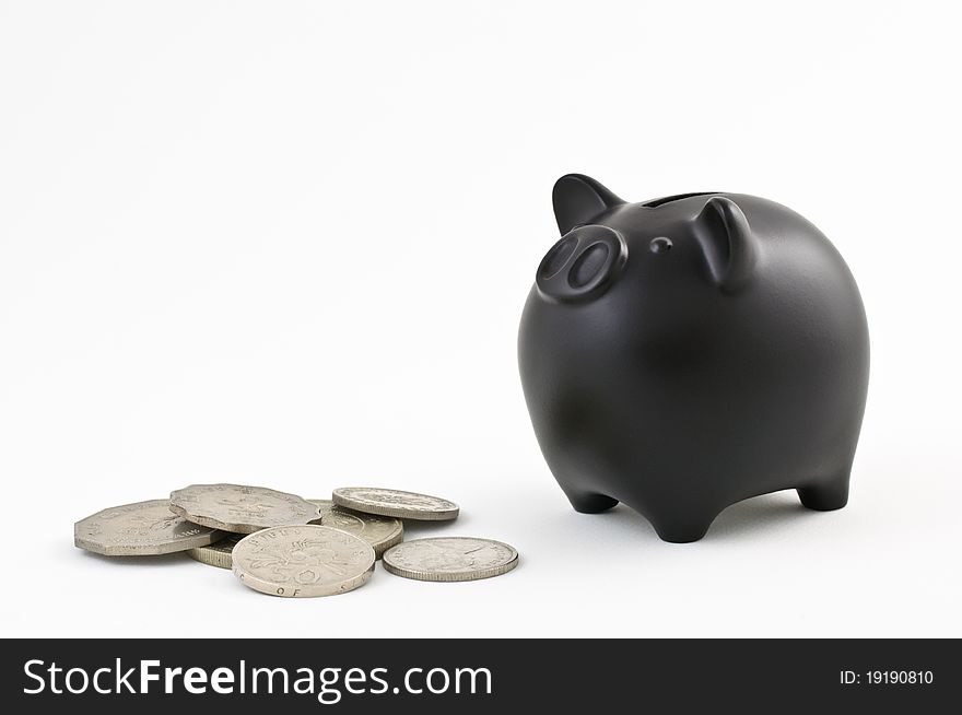 Still life image of a Piggy Bank & Coins. Still life image of a Piggy Bank & Coins