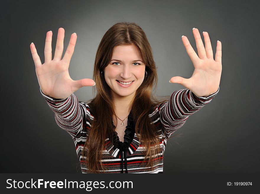 Portrait of pretty woman pointing at you with both hands