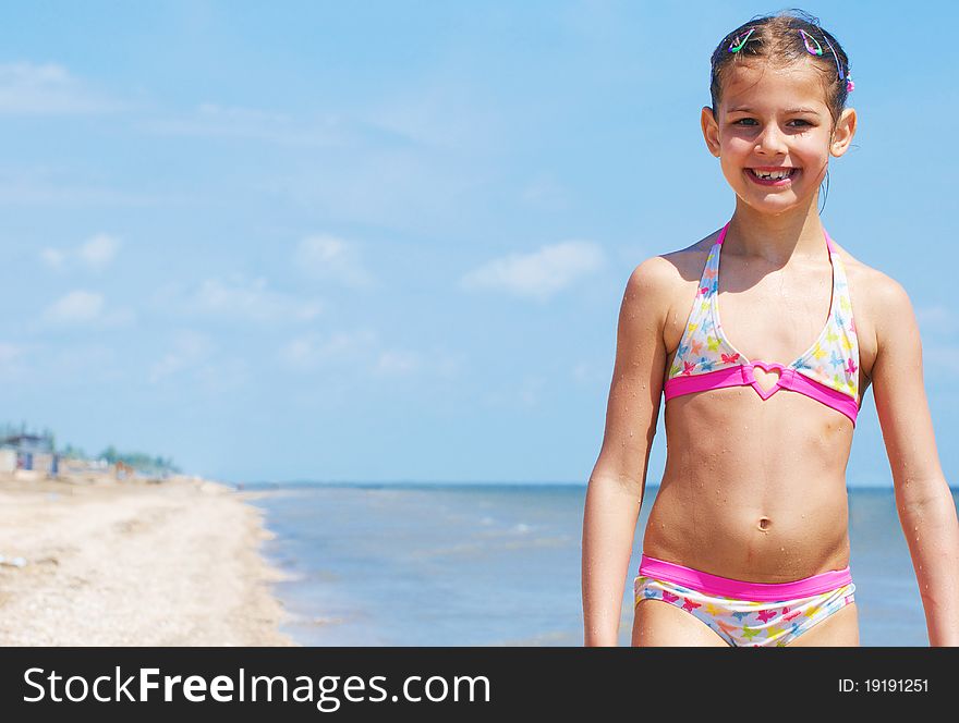 A happy child is running at the beach. A happy child is running at the beach.