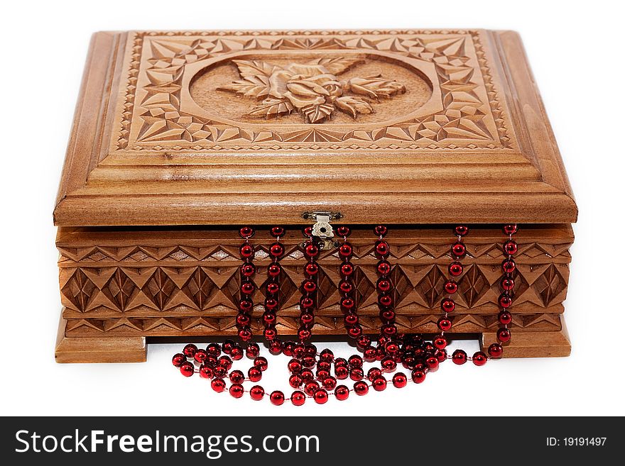 A beautiful wooden box and the beads isolated on white background. A beautiful wooden box and the beads isolated on white background