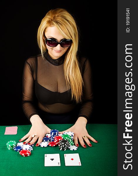 Blond Playing Poker on a green table. Blond Playing Poker on a green table