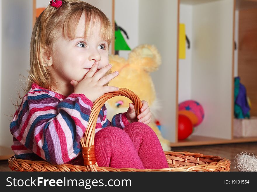 Little girl with basket playing