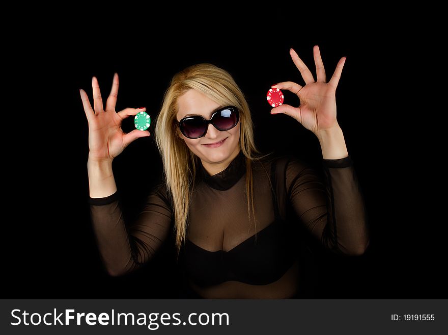 Sexy Blond holding two poker chips. Sexy Blond holding two poker chips