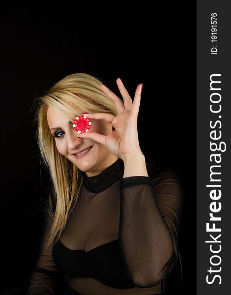 Sexy Blond holding red poker chip. Sexy Blond holding red poker chip