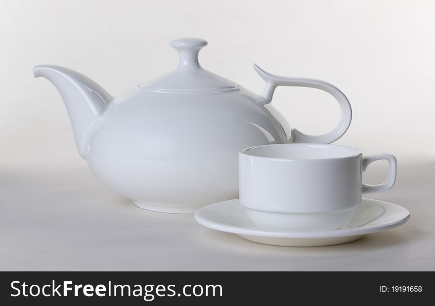 White teapot with a mug